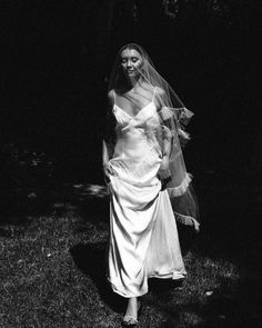 Bride walking in draped gown